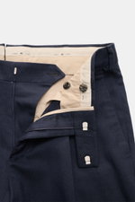 Close-up front view of PT Torino Pants 'Rebel Fit' navy patterned showing zipper, waistband hook, and fine herringbone cotton-wool fabric.