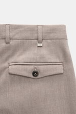 Close-up rear view of PT Torino Trousers 'Rebel Fit' taupe patterned with fine herringbone, buttoned flap pocket, waistband hook, and metal initial.