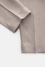 Close-up front view of PT Torino Trousers 'Rebel Fit' taupe patterned, showing fine herringbone cotton-wool fabric, tapered fit, single waistband pleat, and fixed hem cuff. With PT TORINO you are always on point: These comfortably cut trousers in the tren