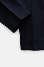 Close-up front view of PT Torino Pants 'Carrot Fit' navy showing twill structure, fixed hem turn-up, and very slim tapering in cotton and virgin wool.