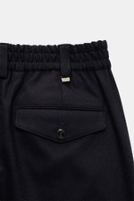 Close-up rear view of PT Torino Wool Pants 'The Rebel' navy showing elastic waistband, buttoned flap back pocket, and soft flannel fabric.