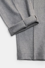 Close-up front view of PT Torino Wool Pants 'The Rebel' grey melange, showing the soft, slightly elastic virgin wool and cashmere flannel fabric with cuffed ankle-length hem. Comfort and style for the cool season: PT TORINO's 'The Rebel' pants impress wit