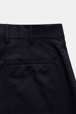 Brunello Cucinelli Wool pants 'Italian Fit' navy shown from a close-up rear perspective, featuring back pockets with button, belt loops, and fine stitching.  
<p>The wool pants of the luxury label BRUNELLO CUCINELLI are a noble classic among trouser model