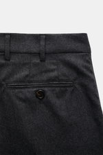 Brunello Cucinelli Wool pants 'Italian Fit' dark grey melange shown from the back upper section, featuring buttoned back pocket, belt loops. The wool pants of the luxury label BRUNELLO CUCINELLI are a noble classic among trouser models and accompany you t