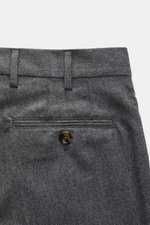 Close-up rear view of Brunello Cucinelli Wool pants 'Italian Fit' grey melange showing back pocket with button, belt loops, and soft virgin wool fabric. The wool pants of the luxury label BRUNELLO CUCINELLI are a noble classic among trouser models and acc