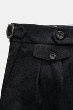 Close-up front view of Brunello Cucinelli Wool Pants anthracite Melange showing double pleats, side adjusters, buttoned flap watch pocket, and textured pure virgin wool fabric. Cult piece in Italian luxury design: These elegant wool pants with double plea