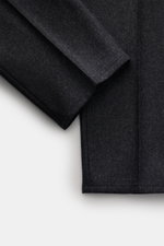 Close-up angled view of Brunello Cucinelli Wool Pants anthracite Melange showing soft pure virgin wool fabric with fine stitching, highlighting double pleats, side adjusters, and small watch pocket details. Cult piece in Italian luxury design: These elega
