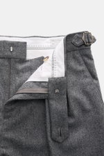 Close-up top view of Brunello Cucinelli Wool Pants Grey Melange showing double pleats, side adjusters, zipper, button, and small watch pocket flap.
