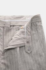 Brunello Cucinelli Wool pants gray/off-white striped, close-up front view showing zipper, button, waistband, and pinstripe details, made from soft virgin wool and cashmere.