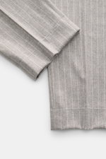 Close-up front view of Brunello Cucinelli Wool pants gray/off-white striped, showing fine virgin wool with cashmere, chalk stripes, single front crease, and unfinished hem.