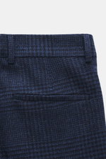 Brunello Cucinelli Wool trousers dark blue/black checked shown from above, highlighting waistband, belt loops, and back welt pocket. These trousers by the luxury label BRUNELLO CUCINELLI are a true classic with their pleated front and elegant Prince-of-Wa