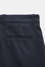 Close-up rear view of Percival Trousers 'Stanley Herringbone' dark blue, made of microfiber, wool, and viscose blend with classic herringbone weave, slightly elastic, soft touch, tapered fit, regular thigh width, ankle-length, featuring zipper and waistba