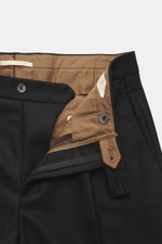 Close-up front view of Briglia 1949 Wool trousers 'Margutta' black, flannel pure new wool, soft feel, regular fit, slightly tapered, zipper and waistband button, single waistband pleat, French pockets, small watch pocket, piped back pockets, one back pock