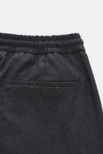 Close-up rear view of Briglia 1949 Wool Jogpants 'Wimbledon' Anthracite Melange showing elastic waistband, welt back pocket, pure wool fabric, soft touch, lightweight, tapered fit, regular thigh width, ankle length, slightly tapered, elastic waistband wit