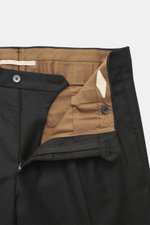 Close-up front view of Briglia 1949 Wool trousers 'Platti' dark grey melange showing zipper, waistband button, soft flannel pure new wool, slightly elastic, regular fit, tapered, double waistband pleat, slant welt pockets, and back pockets with button.