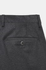 Close-up rear view of Briglia 1949 Wool trousers 'Platti' grey melange, showing double waistband pleat, back pockets with button, slant welt pockets, zipper and waistband button, slightly tapered regular fit, flannel made of pure new wool with slightly el