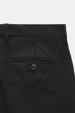 Close-up rear view of Briglia 1949 Wool pants 'Naviglio' anthracite, made of fine twill virgin wool with soft touch, regular fit, slightly tapered, featuring back pockets with button, French pockets, small watch pocket, zipper, and waistband button, combi