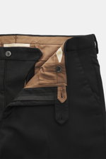 Close-up front view of Briglia 1949 Wool pants 'Naviglio' black showing zipper, button, and brown inner lining. Soft touch meets timeless aesthetics: The 'Naviglio' pants by BRIGLIA 1949 combine high wearing comfort with an elegant silhouette and feature 