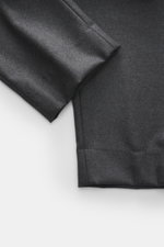 Close-up top-down view of Officine Générale Wool Jogpants 'Walter' dark grey melange showing soft twill wool fabric and tapered fit hem details, Parisian casualness with a modern touch.  

Description:  
<p>Parisian casualness with a modern touch: OFFICIN