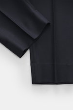 Close-up front view of Officine Générale Wool pants 'Hoche' navy, showing soft twill virgin wool fabric, tapered fit, ankle-length hem.