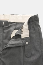 Close-up from above of the open waistband and fly of GTA Wool Pants 'Luca' grey melange, showcasing noble virgin wool fabric with light stretch, smooth feel, fine twill structure, tapered fit, regular thigh width, ankle length, flexible waistband with pat