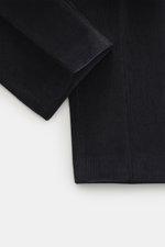 Close-up image of Hiltl Corduroy pants 'Parma' navy, showing cotton corduroy fabric texture from top-down perspective, soft feel, regular fit, slightly tapered, zip fly and waistband hook, French pockets, back pockets with button.