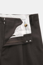 Brunello Cucinelli Wool Trousers Dark Brown shown from front top close-up, twill pure new wool, grippy texture, regular fit, slightly tapered, zipper and waistband button, double waistband pleat, side seam pockets, back pockets with flap.