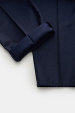 Close-up view of folded cuff and fabric detail of Brunello Cucinelli Wool jogger pants 'Leisure Fit' navy, made of pure virgin wool with smooth feel, leisure fit, tapered cut, high waist, short cut, partially elasticated waistband with drawstring, zip and