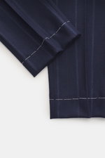 Brunello Cucinelli Wool Trousers Navy Striped shown from a close-up side angle, highlighting the soft wool-cashmere fabric, pleated front, subtle stripes, and detailed stitching. These trousers feature a mix of cashmere and virgin wool, soft feel, regular