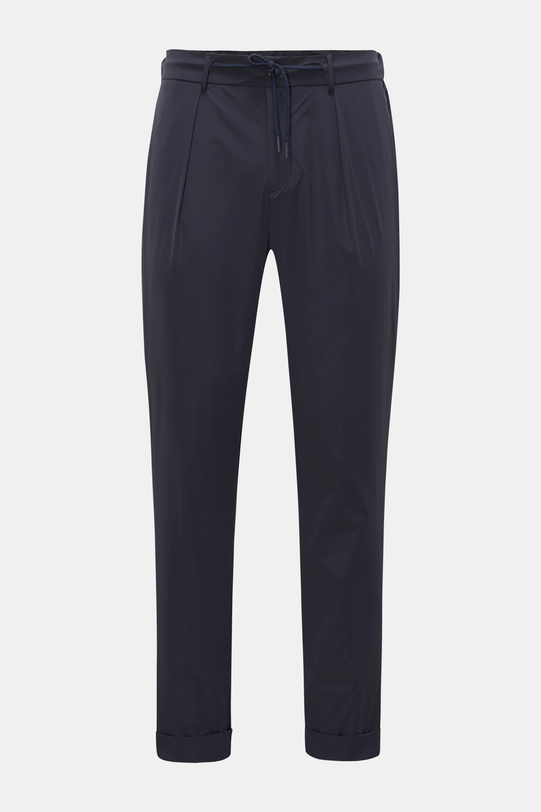 The Product is the Hero Jogpants 'Travel Pant' navy shown from the front, ultralight and bi-elastic microfiber with slim fit, short cut, high waist, drawstring waistband, zipper and button, functional water-repellent fabric, smooth texture, French front p