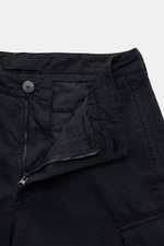 Close-up front view of Stone Island Cargo trousers 'Ghost Piece' dark navy showing open zipper, button, and waistband details in cotton-linen blend.

Description: <p>Get an incognito look with these cargo pants from the 'Ghost Collection' by Stone Island 