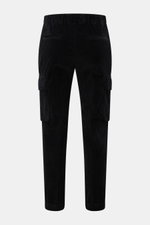 Rear view of 04651/ A trip in a bag Corduroy cargo pants black in wide wale cotton corduroy with slight stretch, soft feel, tapered fit, regular thigh width, ankle length, slightly tapered cut, zip and waist button, partially elasticated waistband with dr