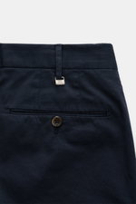 Close-up rear view of PT Torino Chinos 'Slim Fit' navy showing cotton twill fabric, jetted back pocket with button, belt loop with metal PT tag.

<p>For these chinos, PT TORINO has chosen classic cotton twill in fine fabric enhanced with slight stretch co