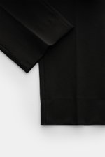 Schwarze GTA Hose 'Davide' aus Baumwoll-Jersey, schmal zulaufend, knöchellang, Regular Fit, von oben fotografiert, mit elastischem Bund und Taschen.