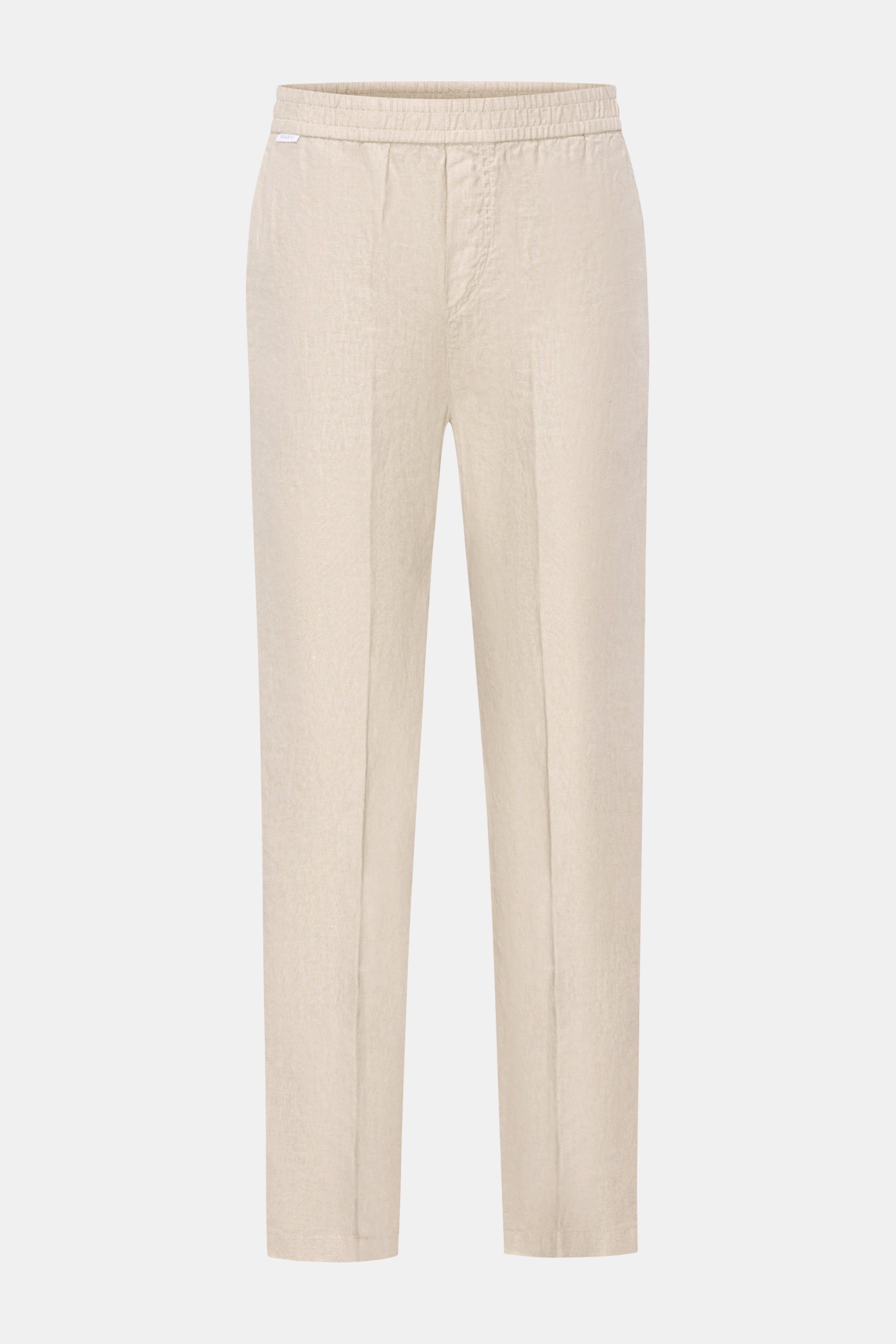 Front view of 04651/ A trip in a bag Leinen-Jogpants 'Linen Pants' beige made from pure linen with typical material texture, tapered fit, regular thigh width, ankle length, straight cut, elastic waistband, small woven label, French pockets, and patch back
