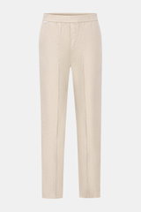 Front view of 04651/ A trip in a bag Leinen-Jogpants 'Linen Pants' beige made from pure linen with typical material texture, tapered fit, regular thigh width, ankle length, straight cut, elastic waistband, small woven label, French pockets, and patch back
