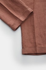 Close-up top view of 04651/ A trip in a bag Linen jogger pants 'Linen Pants' rust brown showing fabric texture and cuff detail.

<p>Perfect for warm days: These linen jogger pants by 04651/ A TRIP IN A BAG are the ideal summer essential – for travel or fo