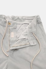 Marco Pescarolo Corduroy Pants 'Dieci' Light Grey shown from a top-down close-up perspective, featuring cotton corduroy fabric, slightly elastic quality, soft touch, elastic waistband with drawstring, zip and button closure, highlighting the versatile jog
