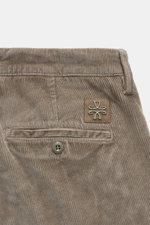 Jacob Cohen Corduroy Pants 'Bobby' taupe shown from close-up rear view, highlighting logo patch, button, and soft cotton blend fabric.