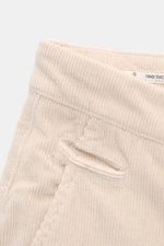 Close-up top view of Jacob Cohen Corduroy Pants 'Bobby' cream showing soft cotton blend corduroy, zip, button, French pockets, piped coin pocket, back pockets with button, and small logo patch, reflecting precise Italian craftsmanship in a slim, slightly 