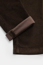 Close-up image of the Jacob Cohen Corduroy Pants 'Bobby' Dark Brown, showing the folded cuff and fine corduroy texture from a top-down perspective. Precise Italian craftsmanship - this is what the label JACOB COHEN stands for, creating a bestseller for th