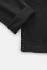 Close-up top-down view of Jacob Cohen Pants 'Bobby' black showing the folded cuff, twill cotton-lyocell fabric, and detailed stitching.