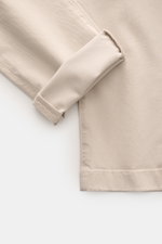 Close-up view of the folded cuff and fabric texture of Jacob Cohen Pants 'Bobby' sand, slim-fit twill cotton and lyocell with stretch.