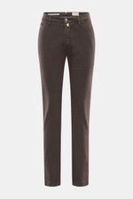Front view of Jacob Cohen Pants 'Bobby' dark brown, slim cut with soft cotton-lyocell twill, elastic quality, zipper, waistband button, French pockets, piped coin pocket, back button pockets, and tonal leather patch. Rely on modern luxury in everyday life