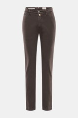 Front view of Jacob Cohen Pants 'Bobby' dark brown, slim cut with soft cotton-lyocell twill, elastic quality, zipper, waistband button, French pockets, piped coin pocket, back button pockets, and tonal leather patch. Rely on modern luxury in everyday life