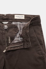 Close-up front view of Jacob Cohen Pants 'Bobby' dark brown, slim-fit cotton-lyocell twill with zipper, button, and patterned inner lining.