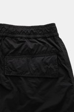 Stone Island Cargo Pants 'Ghost Piece' Black shown from a close-up rear top view, lightweight microfiber, loose fit, elastic waistband, cargo and back pockets with flap, tonal compass badge, adjustable hem.