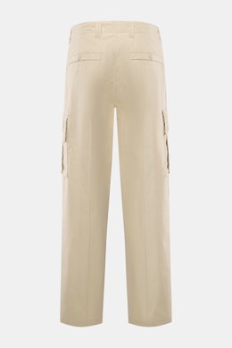 Stone Island Cargo Pants 'Ghost Piece' sand shown from the back, made of smooth cotton poplin, tapered fit, garment dyed with cargo and welt pockets, tonal compass badge. Monochrome all-rounder for casual looks from the Ghost Collection inspired by classi