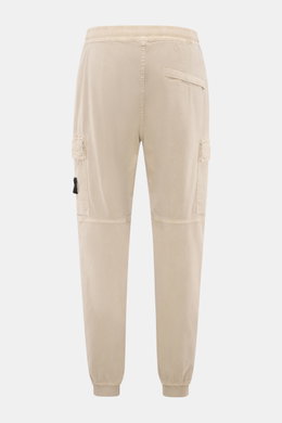 Stone Island Cargo Jogpants beige shown from the back, tapered fit with elastic waistband, cargo and concealed zipper pockets, elastic cuffs.