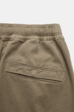 Close-up rear view of Stone Island Cargo Jogpants grey-green showing elastic waistband and back pocket with snap button, made from soft organic cotton. For everyone who wants to combine function and style: These cargo jogpants by STONE ISLAND are inspired